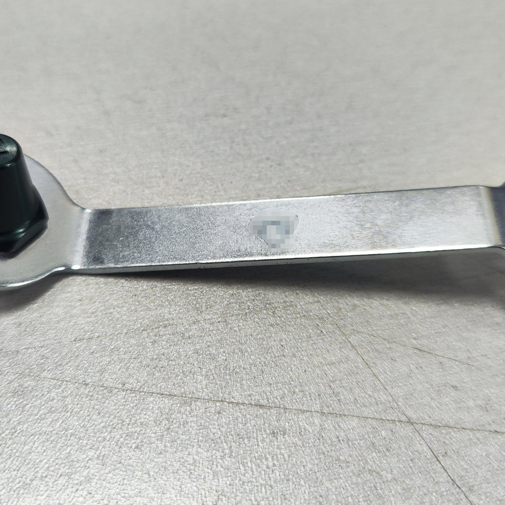
                      
                        Lightweight aluminum replacement studs with stud key on a table.
                      
                    